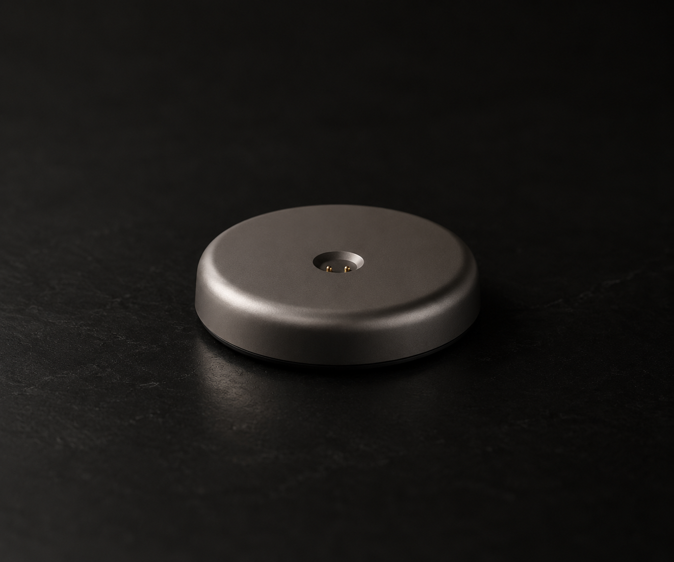 Titan charging dock on a dark stone surface